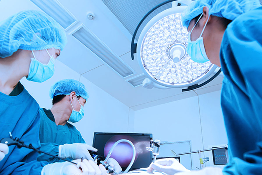 Laparoscopic surgical team performing endoscopic hernia repair